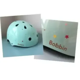 Bobbin Starling bike helmet with star pattern (S/M)