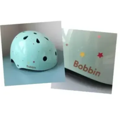 Bobbin Starling bike helmet with star pattern (S/M)